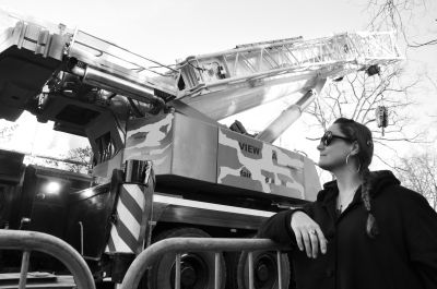 Person standing next to construction vehicle